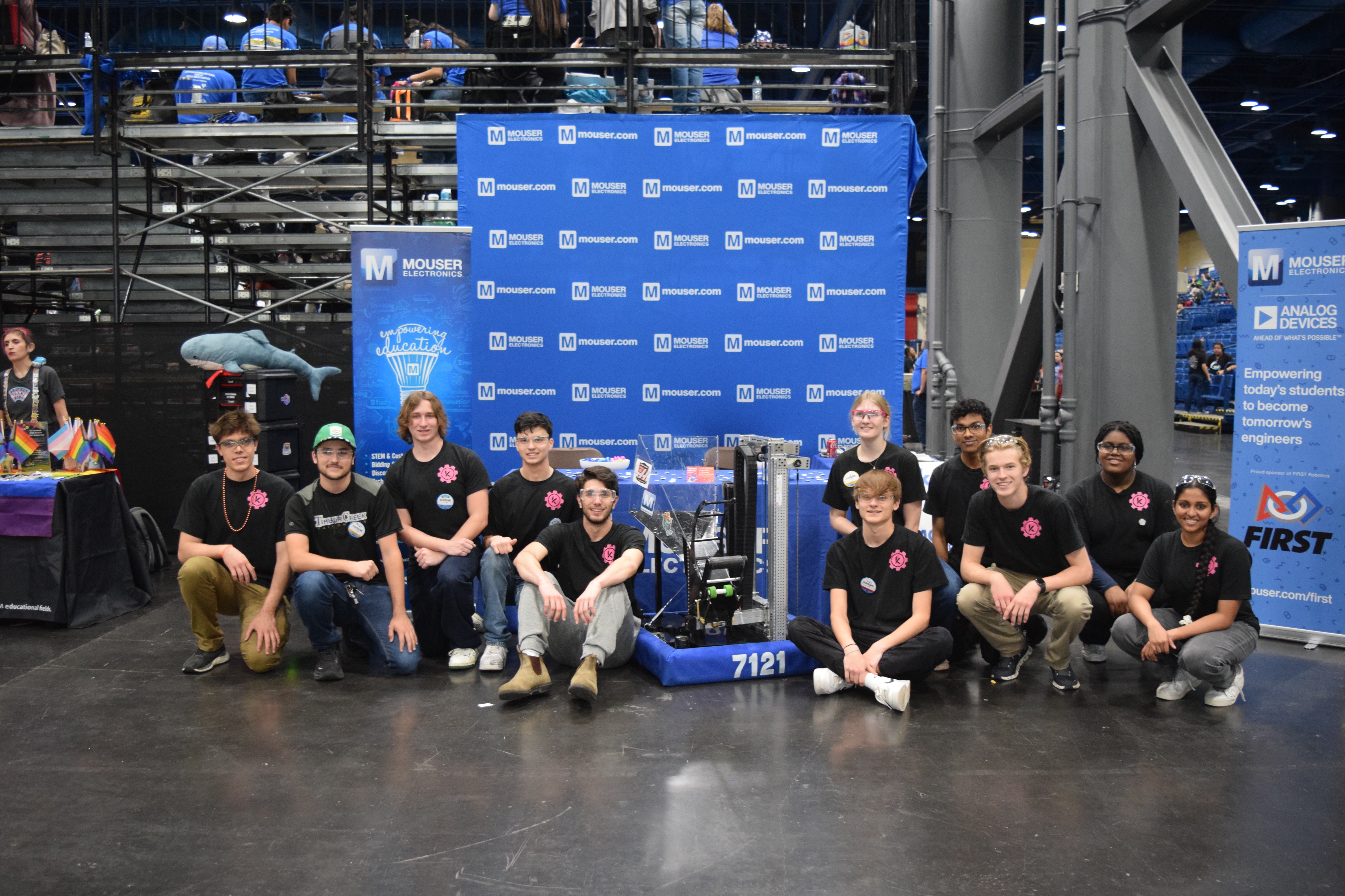 Keller Fusion Robotics Team 7121 at FIRST Robotics competition with their robot and Mouser Electronics sponsorship backdrop